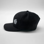 Black cap with white text on a light gray background