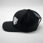 Black cap with a logo on a light gray background