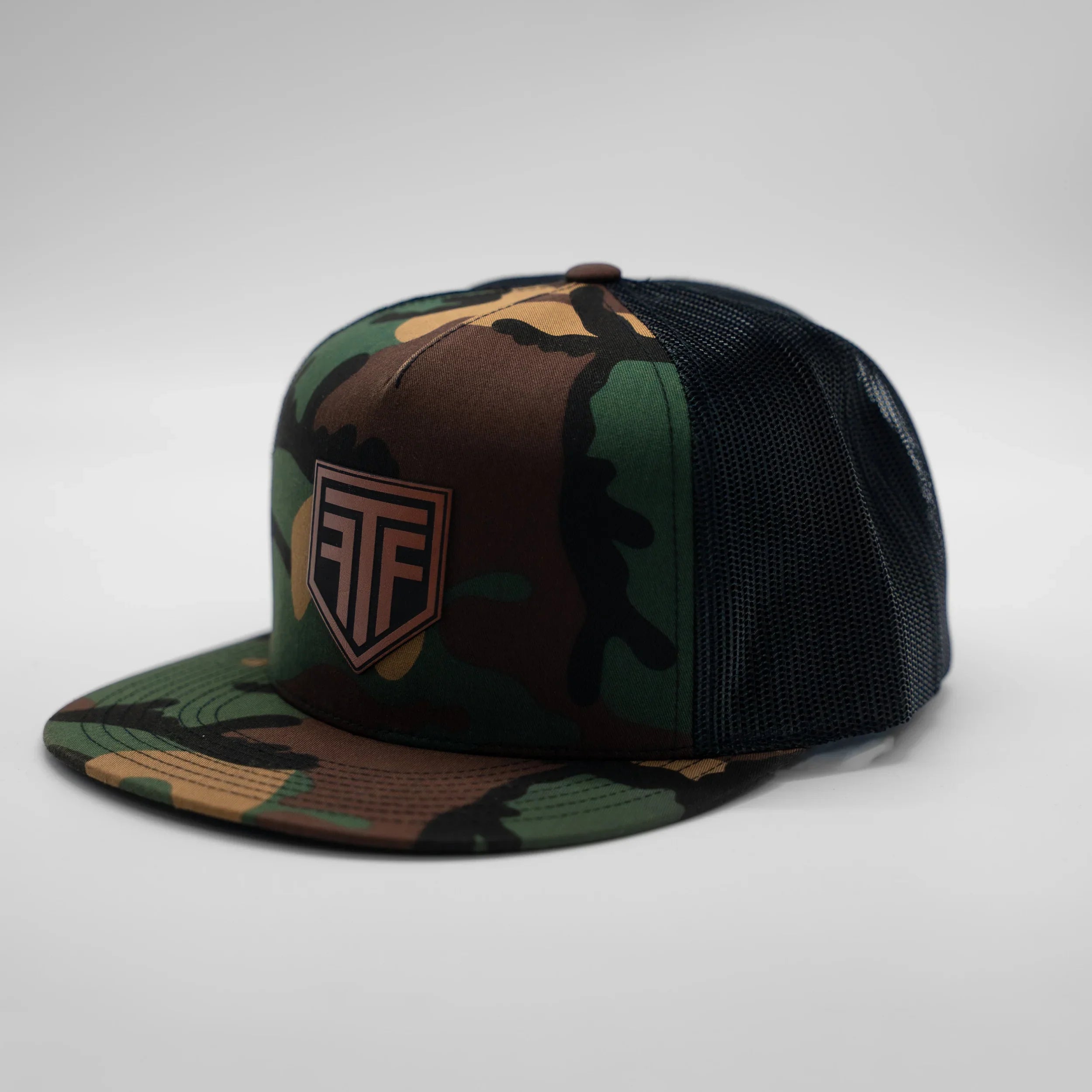 Camouflage baseball cap with a logo on a gray background