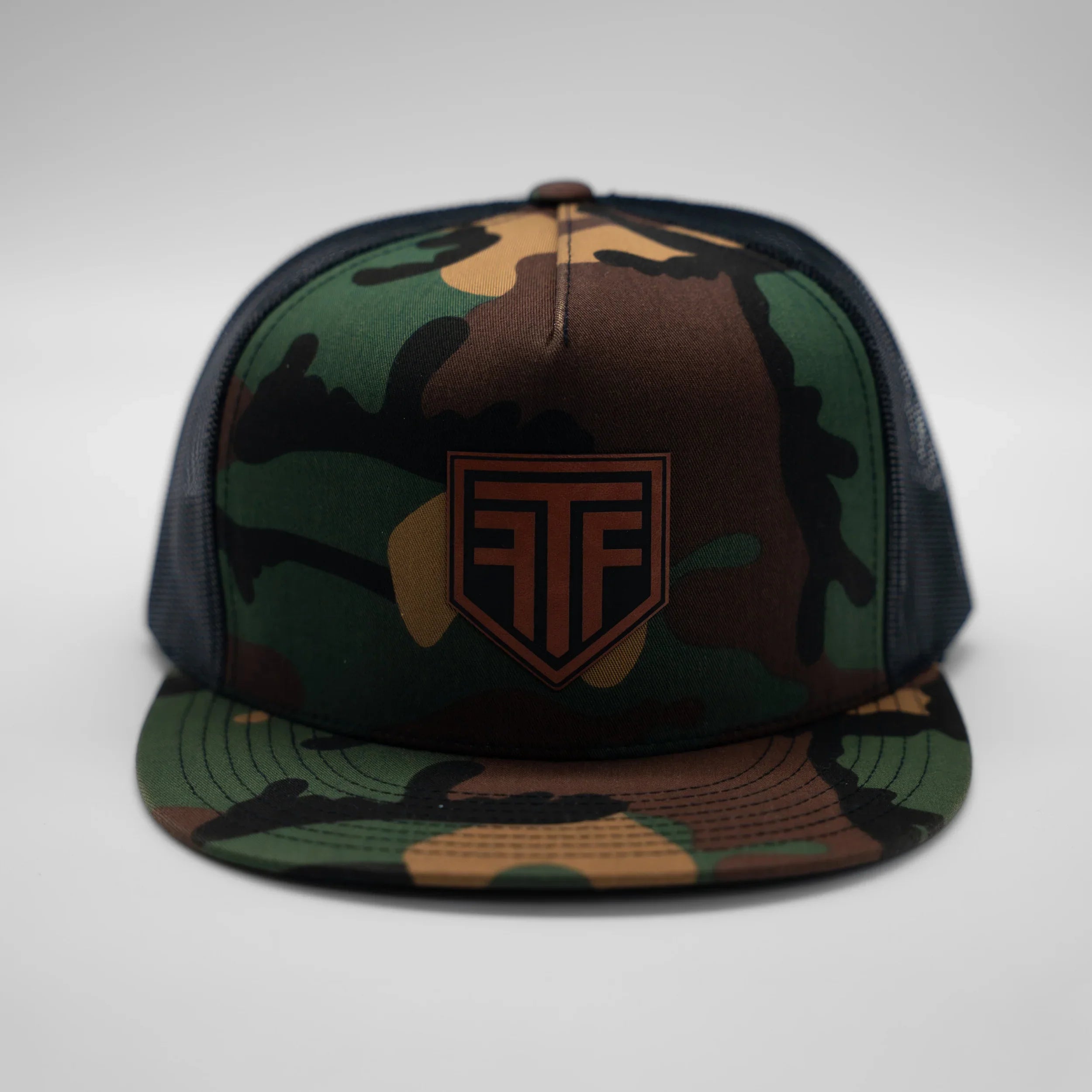 Camouflage cap with a logo on a white background