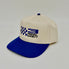A two-tone baseball cap with an off-white crown and a royal blue flat brim. The front of the crown features a blue and black embroidered logo for '3 PEDAL SOCIETY' alongside a blue checkered flag motif.