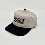 A structured snapback cap with a light gray crown and a black flat brim, featuring a black embroidered logo that reads '3 PEDAL SOCIETY' alongside a checkered flag motif on the front.
