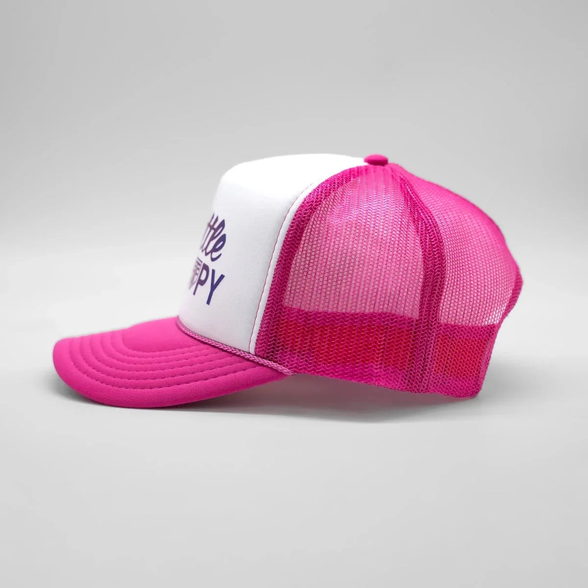 Pink and white cap with text on a gray background