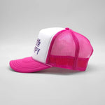 Pink and white cap with text on a gray background