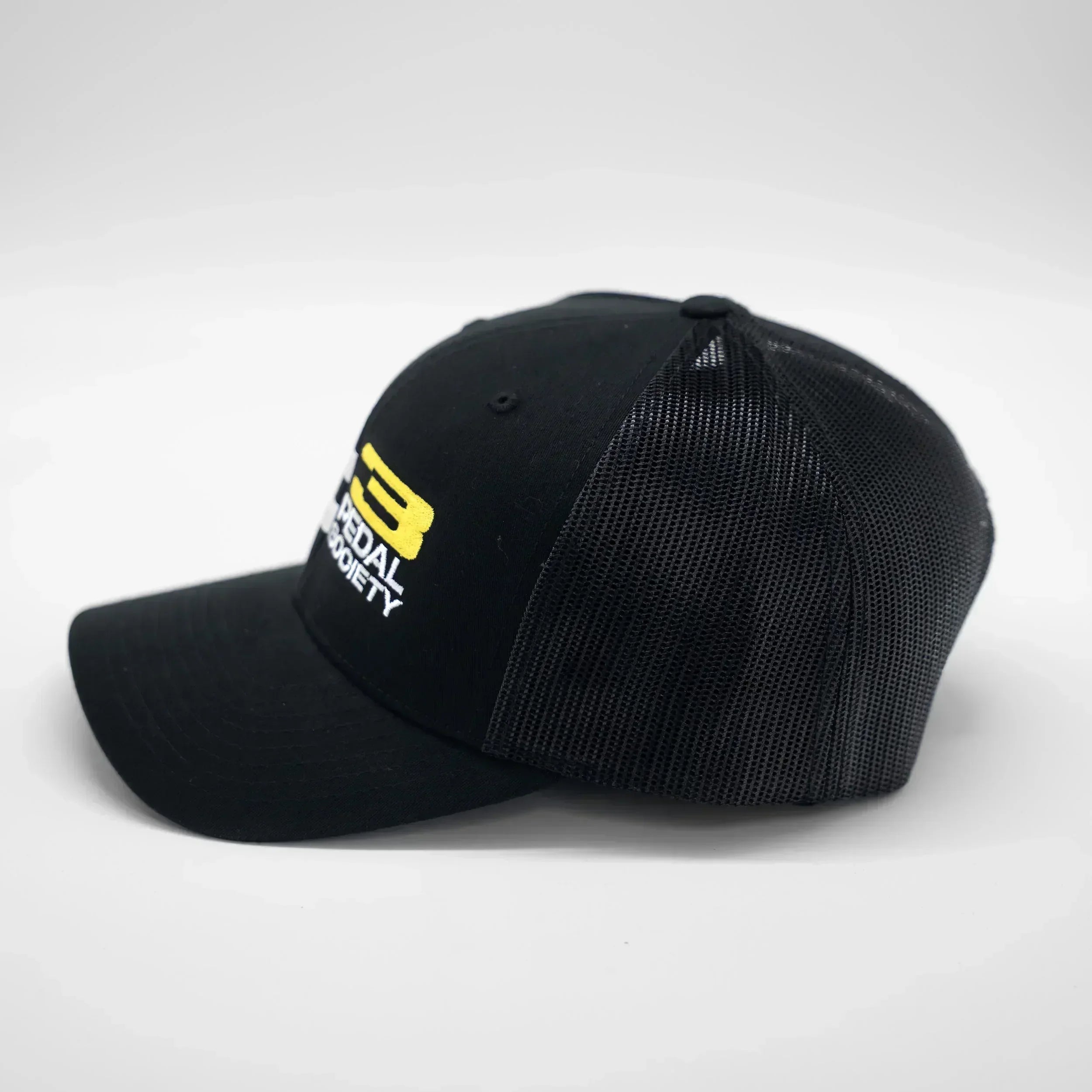 Black cap with a yellow logo on a white background