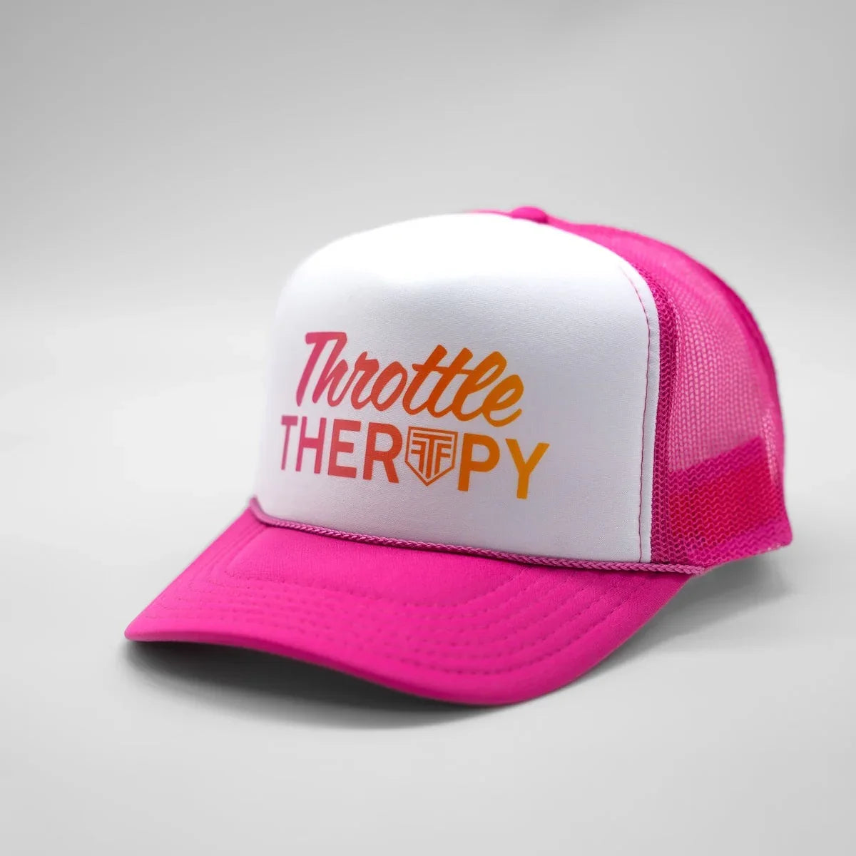 Pink and white cap with 'Throttle Therapy' text on a gray background