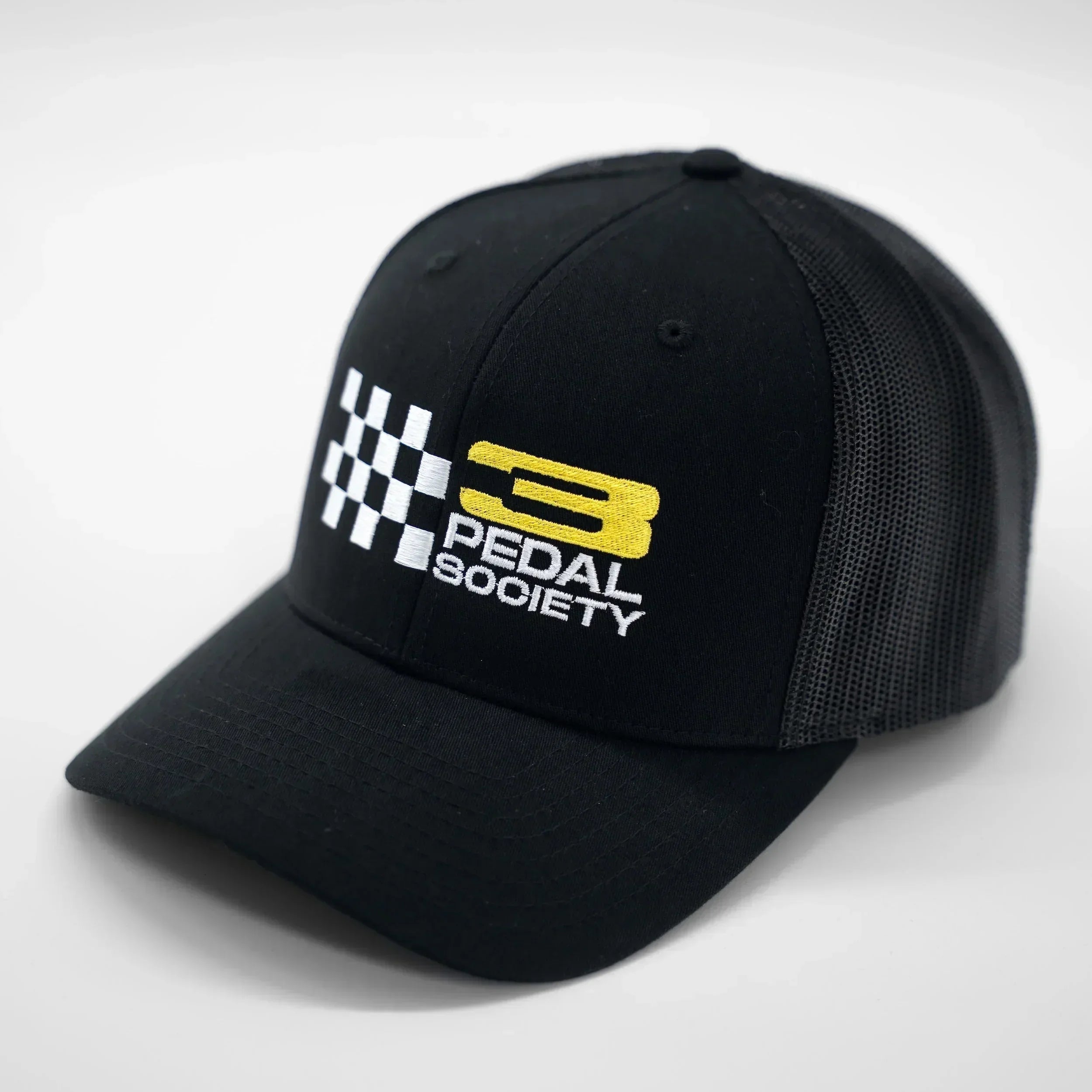 Black cap with 'Pedal Society' logo on a white background