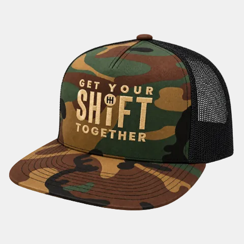 A camouflage trucker hat with a black mesh back, featuring the text 'GET YOUR SHIFT TOGETHER' in beige on the front panel.